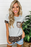 T-shirt con impunture leopardate con accenti di paillettes