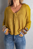 Maglione giallo lavorato a maglia con scollo a V da donna