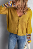 Maglione giallo lavorato a maglia con scollo a V da donna